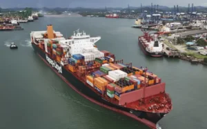 A cargo ship sails through the Panama Canal, in Panama City, Thursday, June 13, 2024.