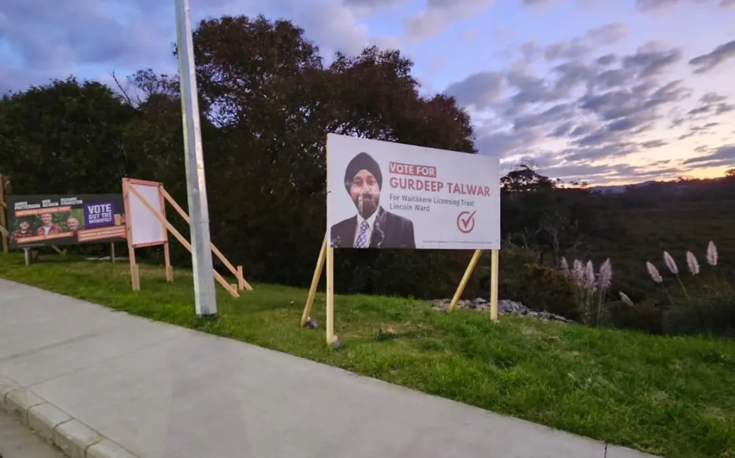 Damaged billboards of Gurdeep Talwar, contesting the Waitākere Licensing Trust’s Lincoln ward seat as an independent