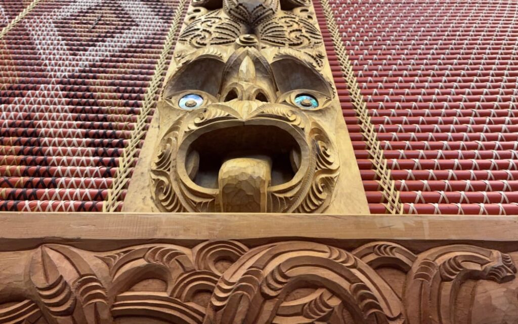 Tukutuku panel and carving inside Parliament's Māori Affairs Select Committee room, Māui Tikitiki-a-Taranga.