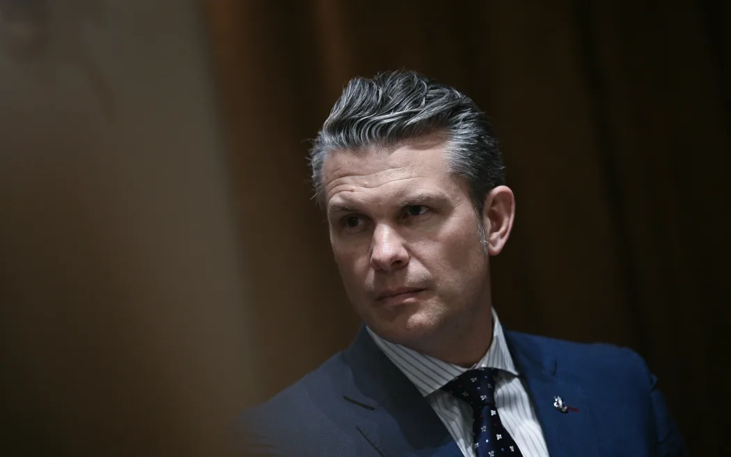 (FILES) US Defense Secretary Pete Hegseth looks on before a luncheon with Italian Prime Minister Giorgia Meloni in the Cabinet Room of the White House, in Washington, DC, on April 17, 2025. US Defense Secretary Pete Hegseth shared information on forthcoming US air strikes on Yemen in a private Signal chat group that included his wife, brother and personal lawyer, the New York Times reported on April 20. AFP was not able to independently verify the Times' report, which detailed what would be the second time Hegseth has been accused of sharing sensitive military information on the commercial messaging app with unauthorized personnel. (Photo by Brendan SMIALOWSKI / AFP)