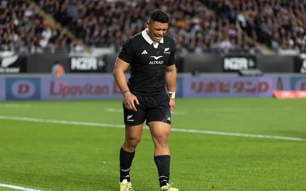 All Blacks winger Caleb Clarke leaves the field injured.
