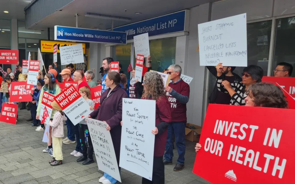 Executive director for the Association of Salaried Medical Specialists, Sarah Dalton, pictured here with loud speaker, says while Finance Minister Nicola Willis has declined to meet striking doctors today, the government needs to hear their message on what under-funding is doing to the public health system.