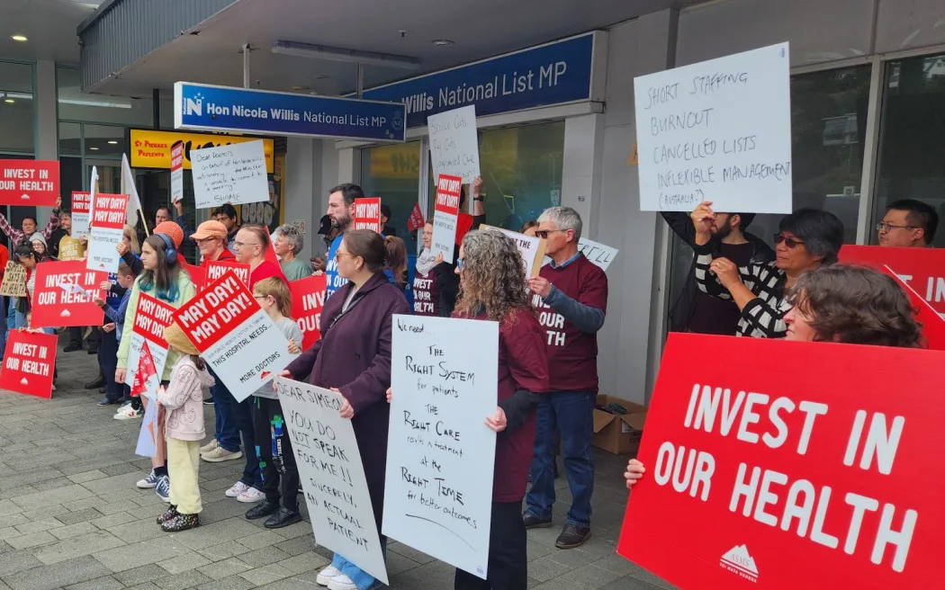 Executive director for the Association of Salaried Medical Specialists, Sarah Dalton, pictured here with loud speaker, says while Finance Minister Nicola Willis has declined to meet striking doctors today, the government needs to hear their message on what under-funding is doing to the public health system.