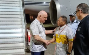 Christopher Luxon arrives in Honiara, greeted by Solomon Islands Foreign Affairs Minister Shanel Agovaka.