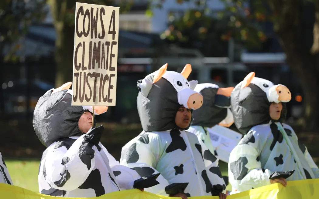 Climate advocates take part on a march in Auckland on 26 May, 2023, demanding New Zealand reduces its emissions, transition to regenerative agriculture, lower the voting age to 16 and respond to the climate crisis with tangata whenua at the center of decision making.