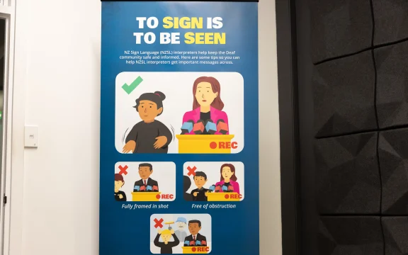 Deaf sign interpretation reminders in the media briefing room inside the Beehive Bunker, properly known as the National Crisis Management Centre, from where national emergency responses are co-ordinated.