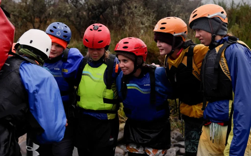 Year 11 Outdoor Ed students from Ellesmere College getting a river crossing pep-talk from their instructor.