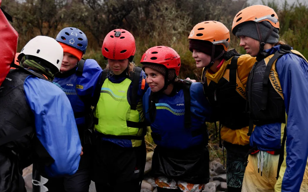 Year 11 Outdoor Ed students from Ellesmere College getting a river crossing pep-talk from their instructor.