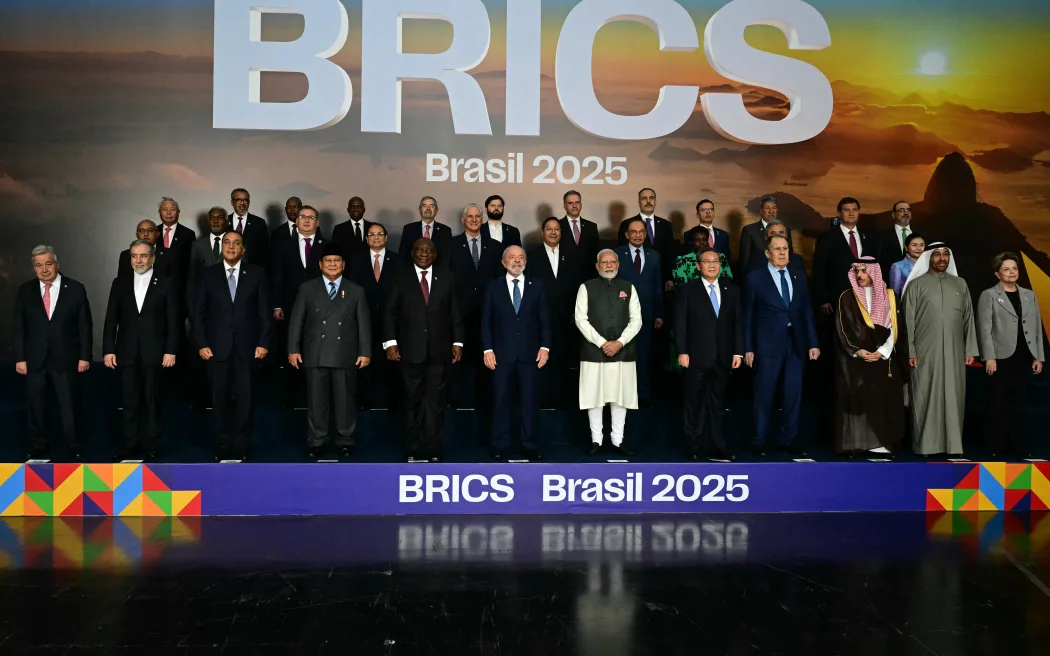 Heads of state and government of member, partner, and external engagement countries pose for a family photo during the BRICS summit in Rio de Janeiro, Brazil, on July 7, 2025. BRICS leaders at a summit on Sunday took aim at US President Donald Trump's "indiscriminate" import tariffs and recent Israeli-US strikes on Iran. (Photo by Pablo PORCIUNCULA / AFP)