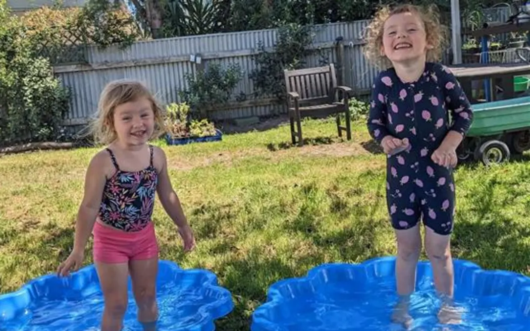 Ivy Collins (left) and sister Imogen playing at their Eskdale home.