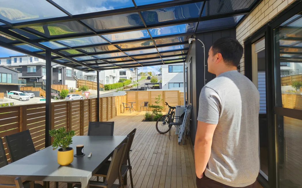 Ken Huang estimates it could cost him more than $30,000 to demolish his deck and put in landscaping according to the original Resource Consent - which he's now seeing for the first time.