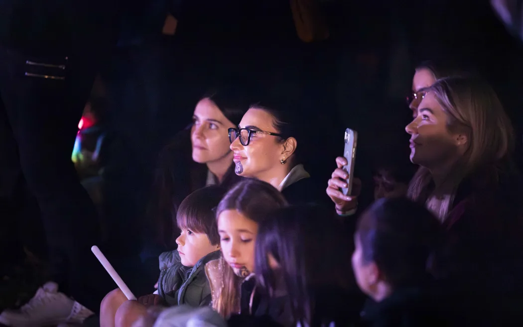 Manuhiri watching Maisey Rika perform at Mārama launch.