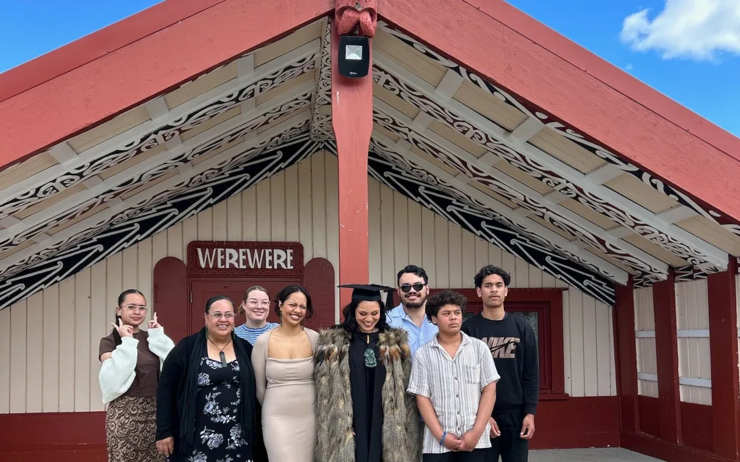 Angel Stewart, wahine Māori lawyer and content creator with her whānau back home outside Werewere whare.