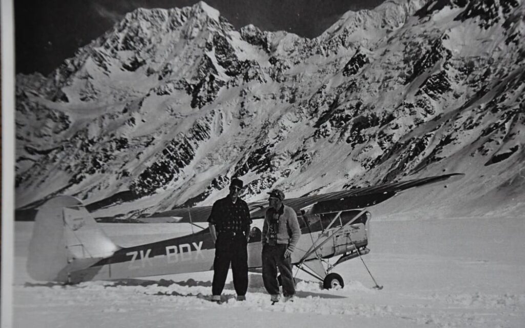 Sir Edmund Hillary (left) was one of the earliest passengers aboard Sir Harry Wigley’s first glacier flights on 22 September, 1955.
