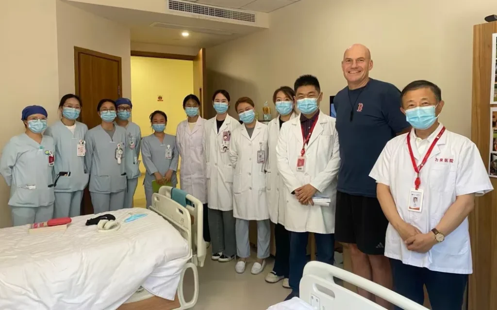 Stu Lye with hospital staff in China where he underwent CAR T-cell therapy.