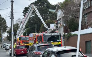 The Fire Service looking at a property on The Terrace in Wellington damaged by high winds.