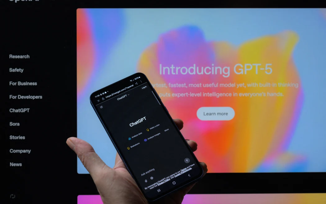 The ChatGPT 5 logo is displayed on a mobile phone. OpenAI announces GPT-5, its latest and most advanced AI model, in Brussels, Belgium, on August 8, 2025. (Photo by Jonathan Raa/NurPhoto) (Photo by Jonathan Raa / NurPhoto via AFP)
