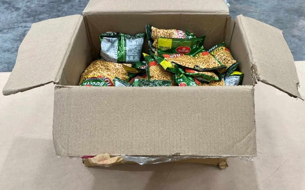 The pills were concealed in snack packets within a container of goods from India.