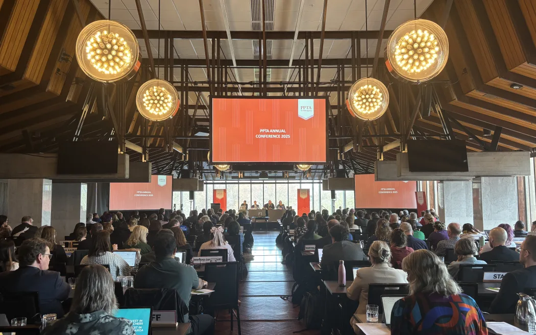Meeting room at Christchurch Town Hall full of Post Primary Teachers Association members listening to opening speeches of 2025 conference.