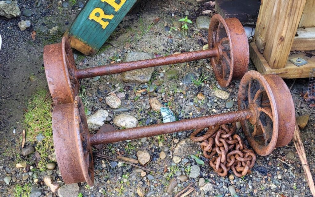 Caption: A man has been fined after attempting to steal artifacts including metal wheels, axles and a chain from the Denniston Mine on the West Coast. Credit: Supplied/Department of Conservation