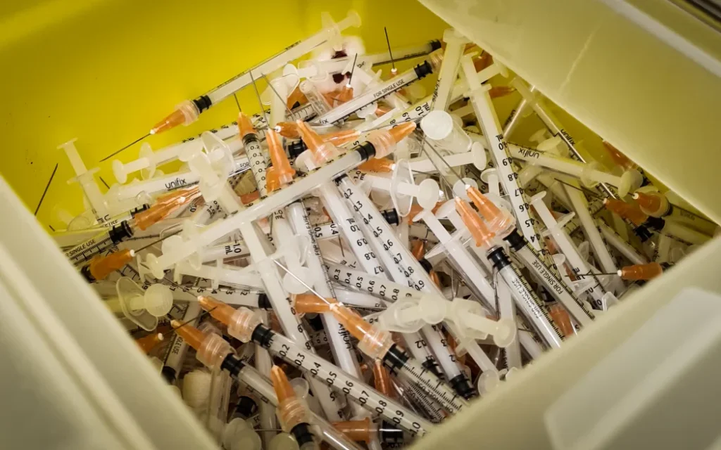 Bin of discarded needles