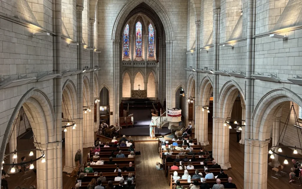 Picture of a church interior and the attendees.