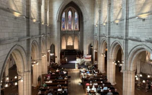 Picture of a church interior and the attendees.