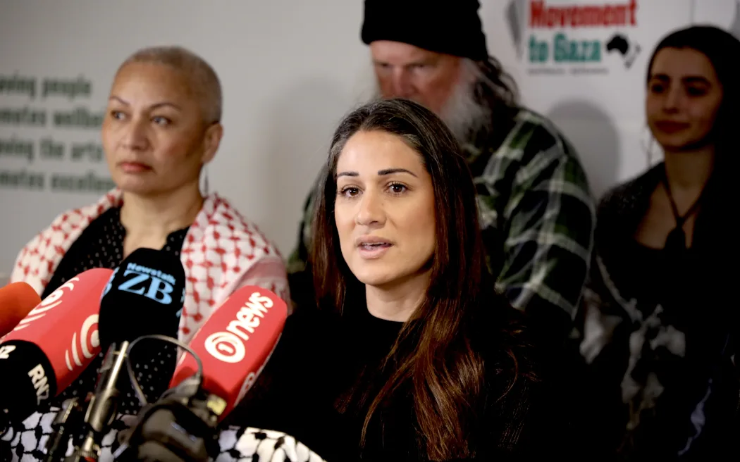 Family members of New Zealanders aboard the flotilla speak at a Green Party stand-up.