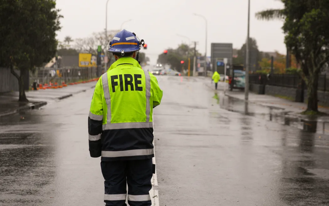 FENZ attend an incident on Blockhouse Bay road following a partial roof collapse along with a street light during a storm in Auckland