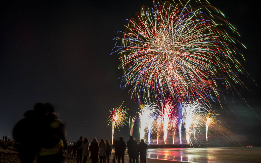 Fireworks illuminate the sky above the New Brighton Pier during Christchurch's first-ever Matariki fireworks spectacular in Christchurch, New Zealand on July 10, 2021. The Matariki is an annual new year celebration of the Maori's, the indigenous people of New Zealand. (Photo by Sanka Vidanagama/NurPhoto) (Photo by SANKA VIDANAGAMA / NurPhoto via AFP)