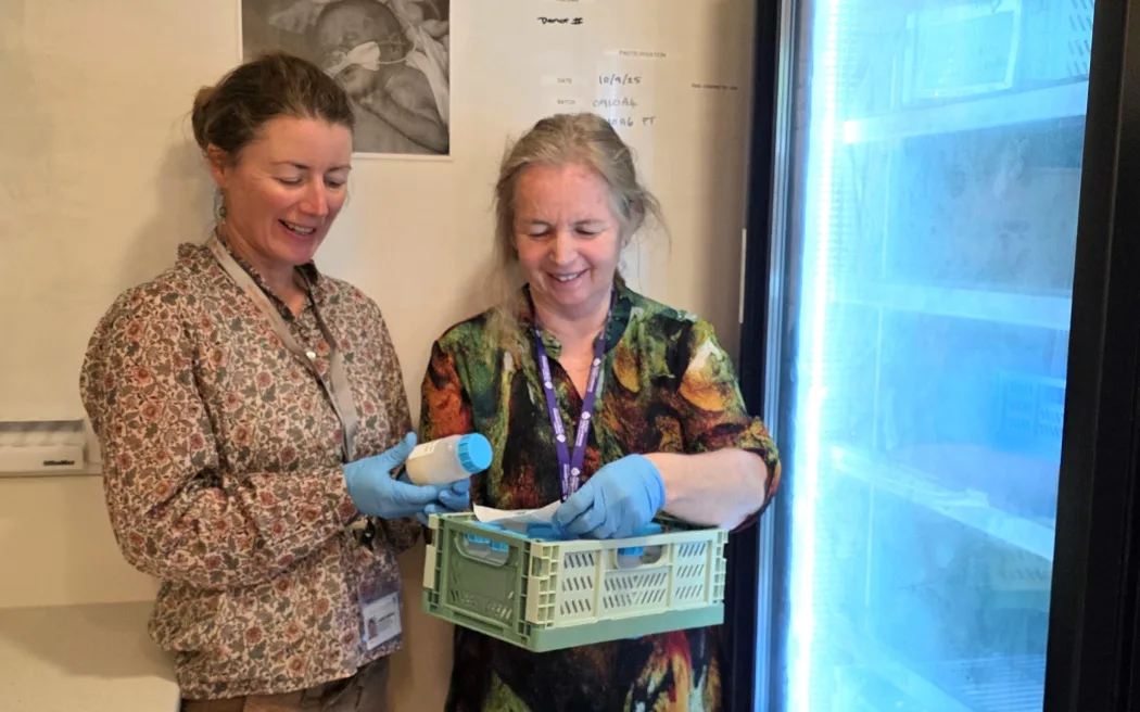 Lactation consultant Janine Parsons and maternity quality and safety leader Lou Rowden check milk before it’s stored in the new freezer.