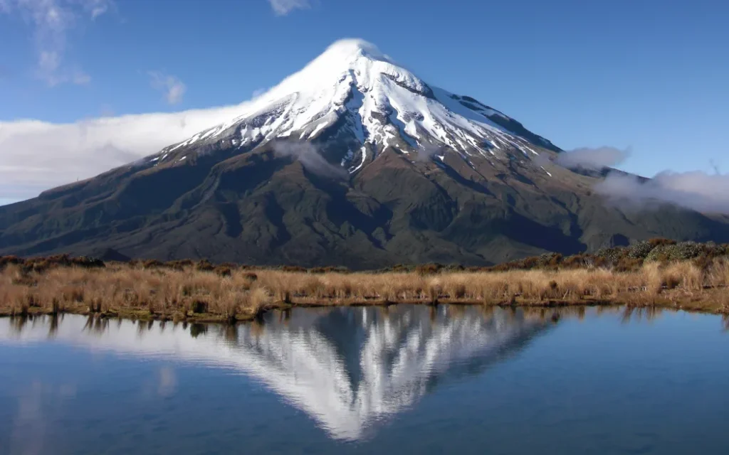 A view of Mt Taranaki over a waterway.