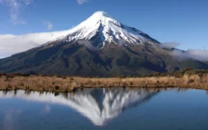 A view of Mt Taranaki over a waterway.