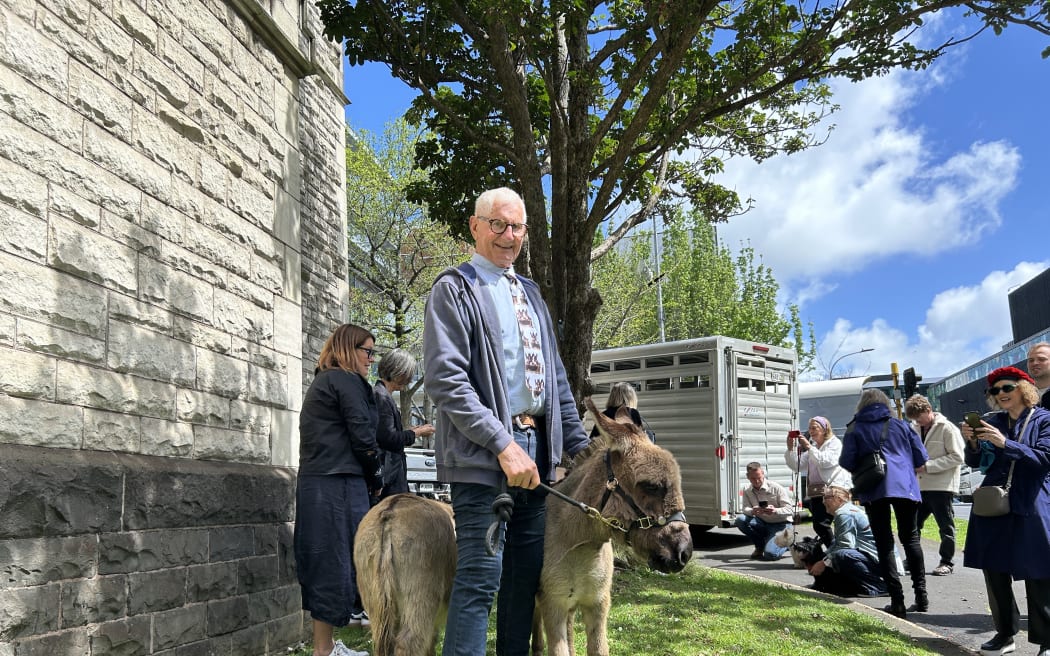 Portrait of a man and a donkey.