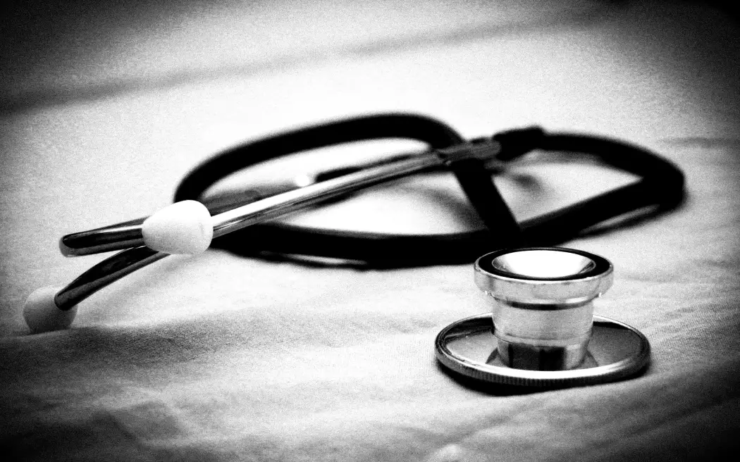 dark vignette and black and white stethoscope.