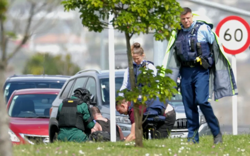 Police have taken a man into custody after an officer was shot in Auckland's Flat Bush. NOTE: use blurred version of this unless supression lifts