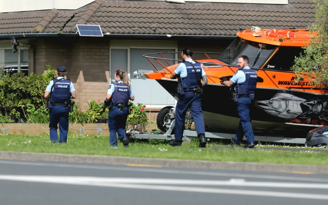 Police said they were called to Flat Bush just about 9.30am, and a gun was fired at police.