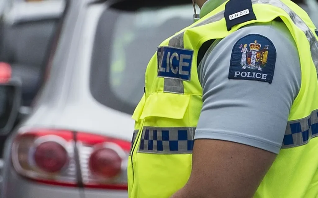 Officer wearing police vest in New Zealand