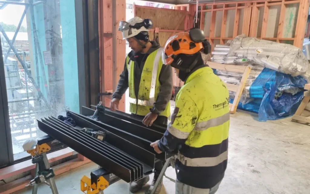 Construction workers putting the final touches to the new East Wing at Taranaki Base Hospital in New Plymouth.