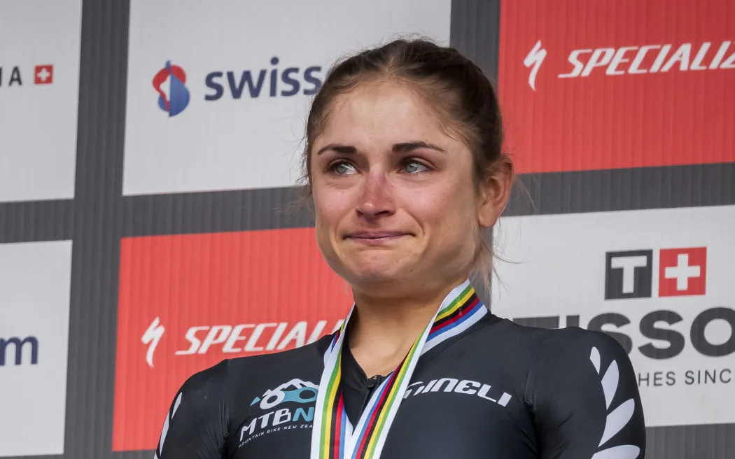 Silver medallist New Zealand's Samara Maxwell reacts on the podium, 2025 UCI Mountain Bike World Championships.