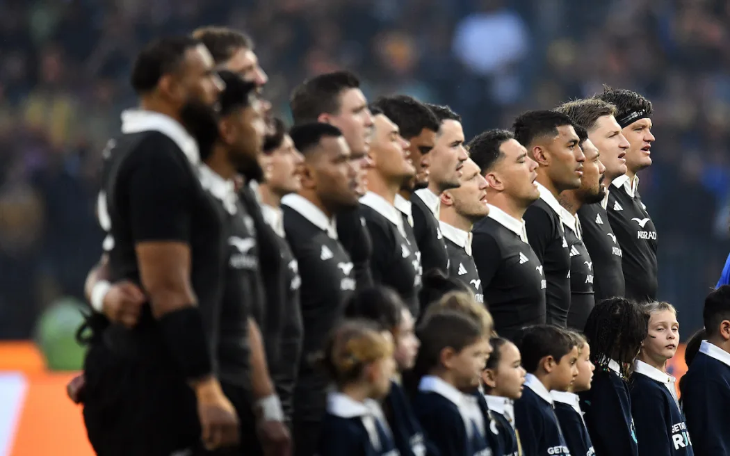 The All Blacks during the national anthem.