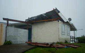 The roof is coming of a house in Newlands, Wellington.