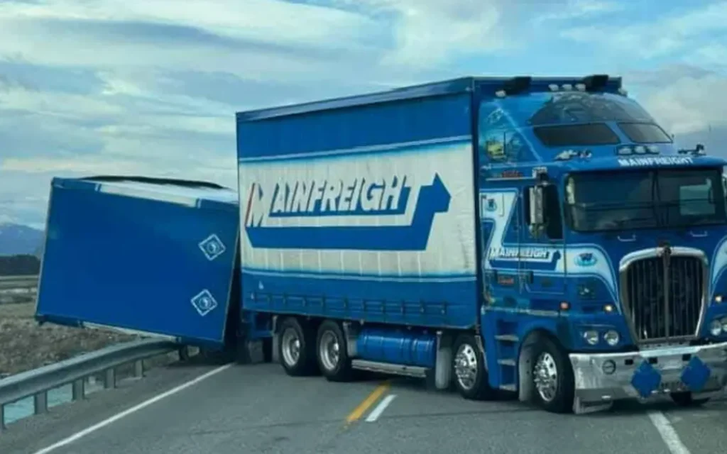 The truck is blocking both lanes at the Tekapo flyover/Tekapo Canal Road intersection.