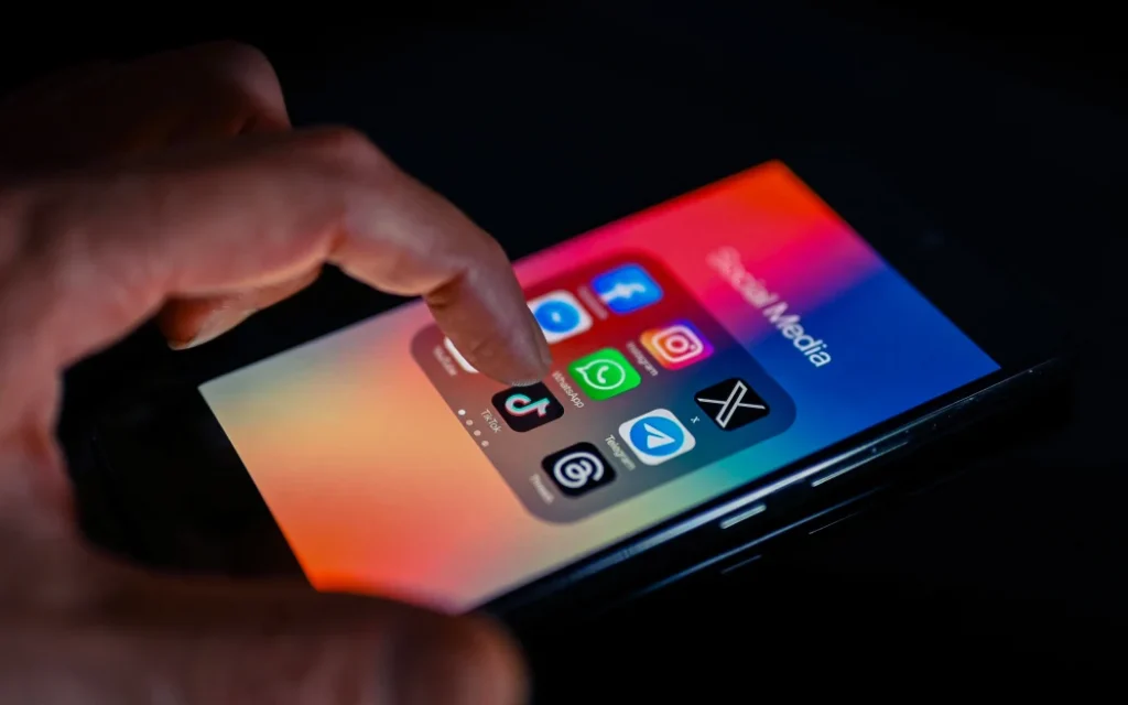 Close - up finger pointing to TokTok mobile app displayed on a smartphone screen alongside that of X,Whatsapp,Facebook,Messenger,Threads,Telegram, on August 15, 2023, in Brussels, Belgium. (Photo illustration by Jonathan Raa/NurPhoto) (Photo by Jonathan Raa / NurPhoto / NurPhoto via AFP)