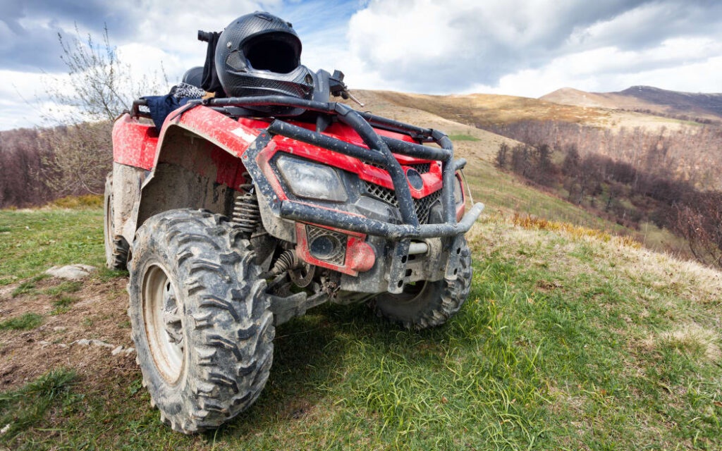 ATV on mountains landscape on a sunny day