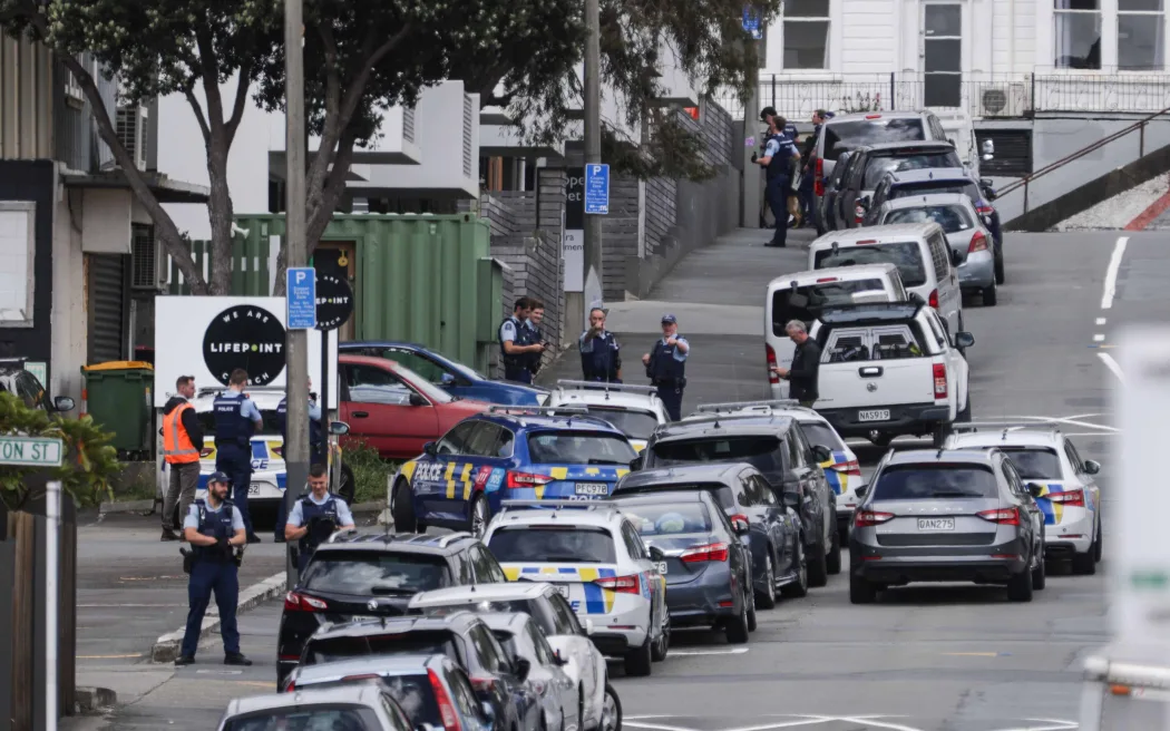 Armed police at the edge of a cordon on Hopper Street, Wellington.