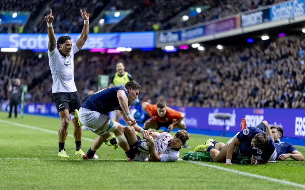 Damian McKenzie scores the winning try against Scotland.