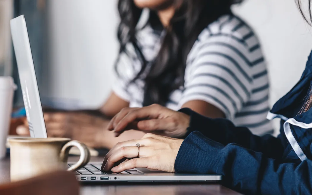close-up of a woman hands while typing