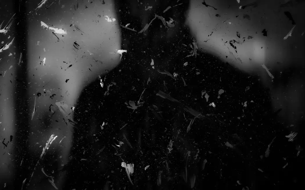 Dark silhouette with paint splatters