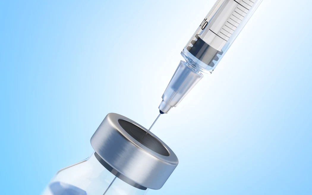 Syringe in phial, illustration. (Photo by SERGII IAREMENKO/SCIENCE PHOTO L / SIA / Science Photo Library via AFP)